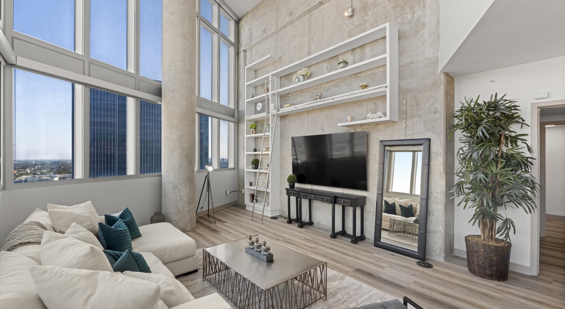 large open living room with floor-to-ceiling windows