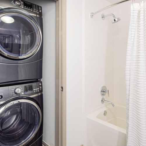 a bathroom with a washer and dryer